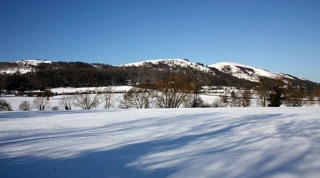 Fields of Little Malvern in the snow Looking from the A4104 towards St. Wulstan's RC church and the Malvern Hills beyond.