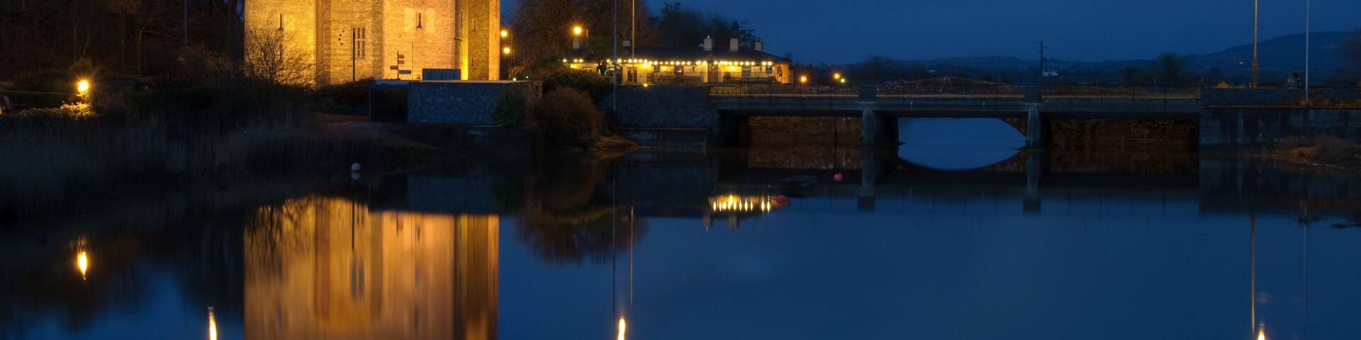 A castle with a moat and a bridge.