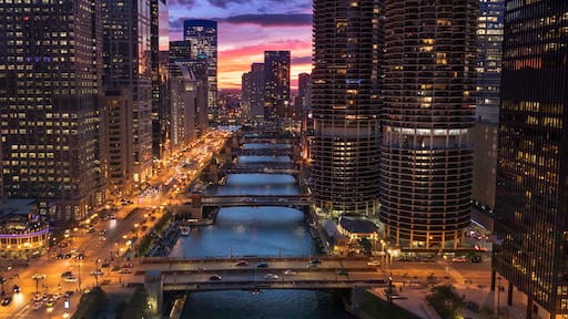 Downtown city buildings and skyline over the Chicago River Illinois USA