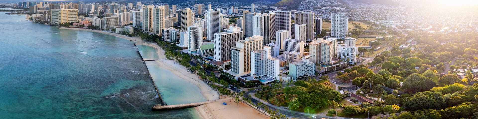 Sunrise panoramic view of the densest parts of Honolulu at Waikiki and its beach and hotels
