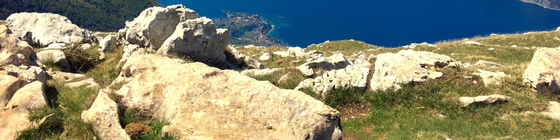 A mountainous landscape with a large body of water and rocky terrain.