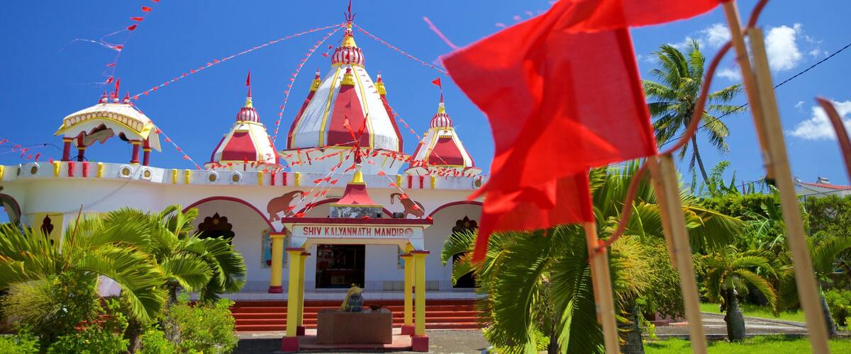 Grand Bay featuring religious elements and a temple or place of worship