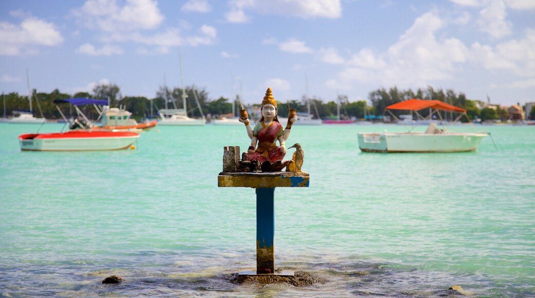 Grand Bay which includes religious elements and general coastal views