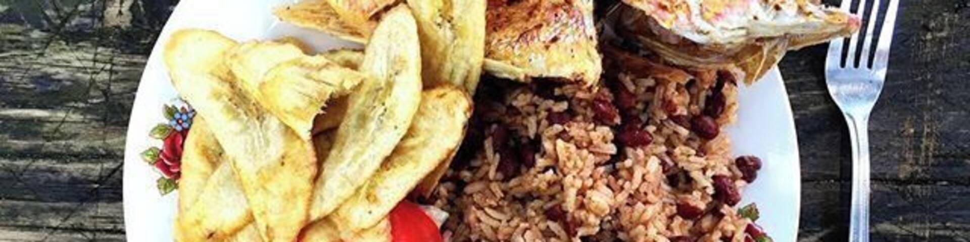 What's' that saying about "teach a man to fish"? Comida Catracho Our lunch cooked by a family in the Jeanette Kawas Nacional Parque just outside of Tela, Honduras. You can't beat the fresh catch! Delicious!