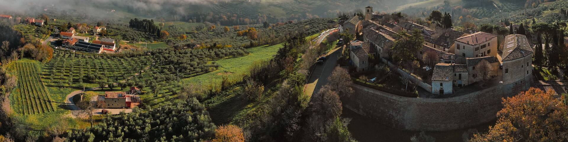 Italy, December 2022: aerial view of the beautiful medieval village of Montegridolfo in the province of Rimini in the Emilia Romagna region bordering the Marche region