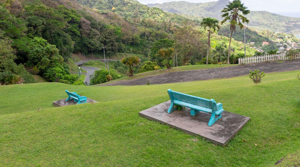 Turquoise benches overlooking lush mountains at Speyside Lookout in Tobago, Trinidad and Tobago