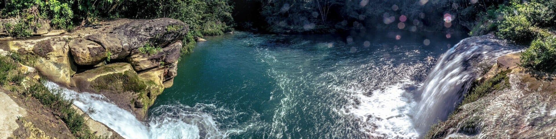 Well inside the Toledo District, in Belize, you'll find different indigenous communities and beautiful natural landscapes, like this double waterfall near Río Blanco.