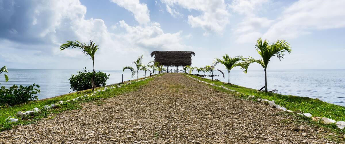 Cabana on a pier overlooking the Caribbean Sea in the town of Punta Gorda, Belize
