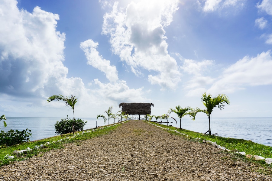 Cabana on a pier overlooking the Caribbean Sea in the town of Punta Gorda, Belize