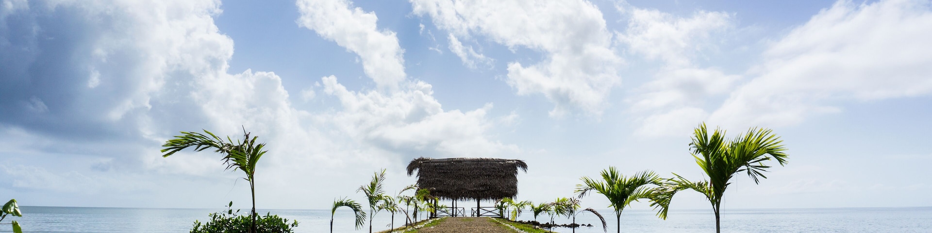 Cabana on a pier overlooking the Caribbean Sea in the town of Punta Gorda, Belize