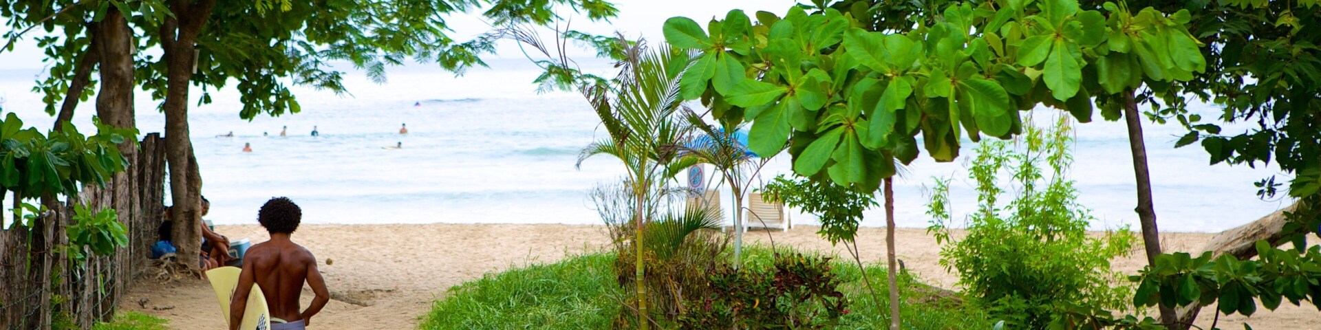 Tamarindo showing a sandy beach as well as an individual male