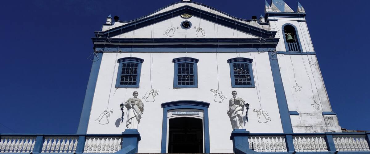 Beautiful church in Portuguese colonial style. It was inaugurated in 1806 and later reformed in the 20th century. It keeps inside a beautiful panel dedicated to Nossa Senhora D'Ajuda. Every year, in February, there is a great party dedicated to the patroness with quermesses and typical foods. On its exterior stand out for the statue of Christ crucified at the base of the staircase.