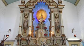 Beautiful church in Portuguese colonial style. It was inaugurated in 1806 and later reformed in the 20th century. It keeps inside a beautiful panel dedicated to Nossa Senhora D'Ajuda. Every year, in February, there is a great party dedicated to the patroness with quermesses and typical foods. On its exterior stand out for the statue of Christ crucified at the base of the staircase.