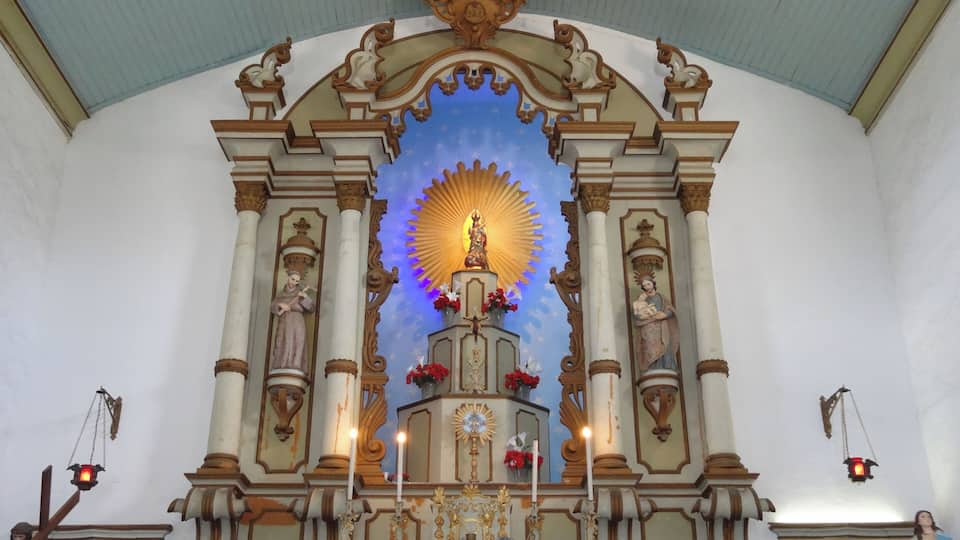 Beautiful church in Portuguese colonial style. It was inaugurated in 1806 and later reformed in the 20th century. It keeps inside a beautiful panel dedicated to Nossa Senhora D'Ajuda. Every year, in February, there is a great party dedicated to the patroness with quermesses and typical foods. On its exterior stand out for the statue of Christ crucified at the base of the staircase.