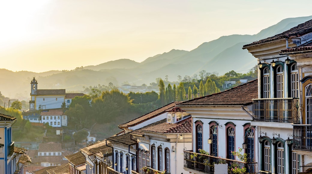 Old houses and churches in colonial architecture from the 18th century in the historic city of Ouro Preto in Minas Gerais, Brazil at sunset