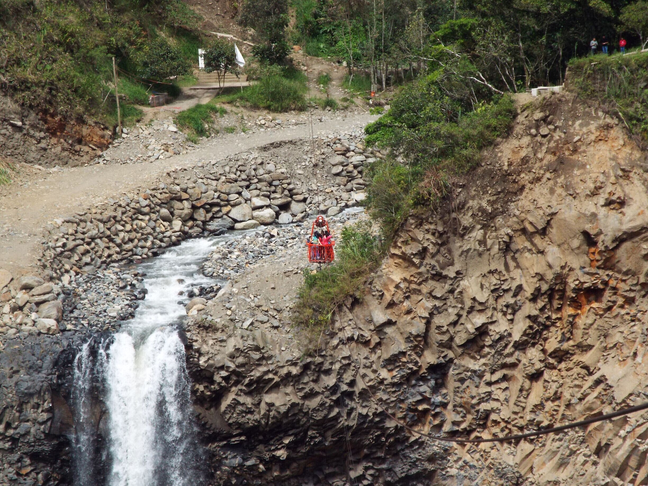 Waterfall Manto de la Novia in Banos, Ecuador. You can use teleferico or canopy tour over the river and waterfall.  A lot of fun!
