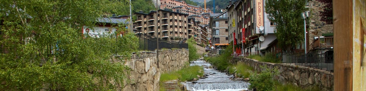 Arinsal showing a cascade, a small town or village and a river or creek