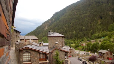 Arinsal which includes a city, mountains and heritage architecture