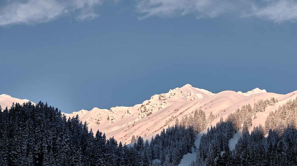 First sun in the morning at summits in montafon mountain range in Gargellen, austria