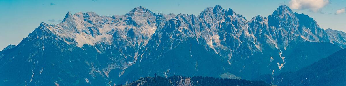 Alpine summer view with the Jacob cross and the Loferer Steinberge mountains in the background at Mount Streuboeden, Fieberbrunn, Kitzbuehel, Tyrol, Austria