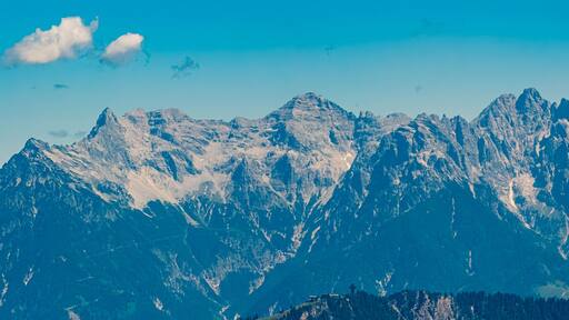 Alpine summer view with the Jacob cross and the Loferer Steinberge mountains in the background at Mount Streuboeden, Fieberbrunn, Kitzbuehel, Tyrol, Austria