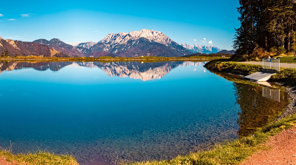 High resolution stitched autumn panorama with reflections in a lake at the famous Streuboeden summit, Fieberbrunn, Tyrol, Austria