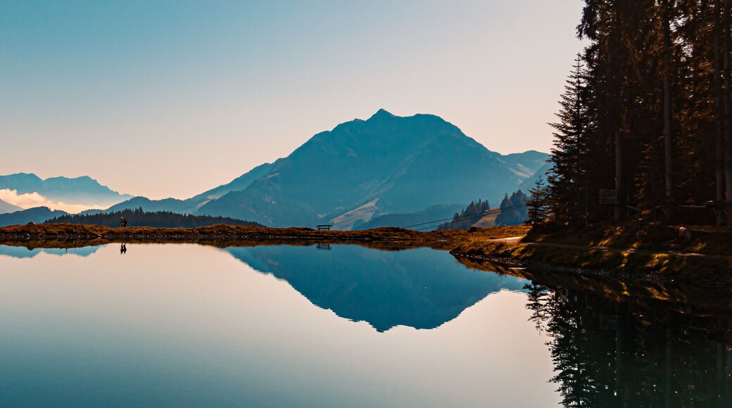 Beautiful alpine view with reflections in a lake at Fieberbrunn, Tyrol, Austria