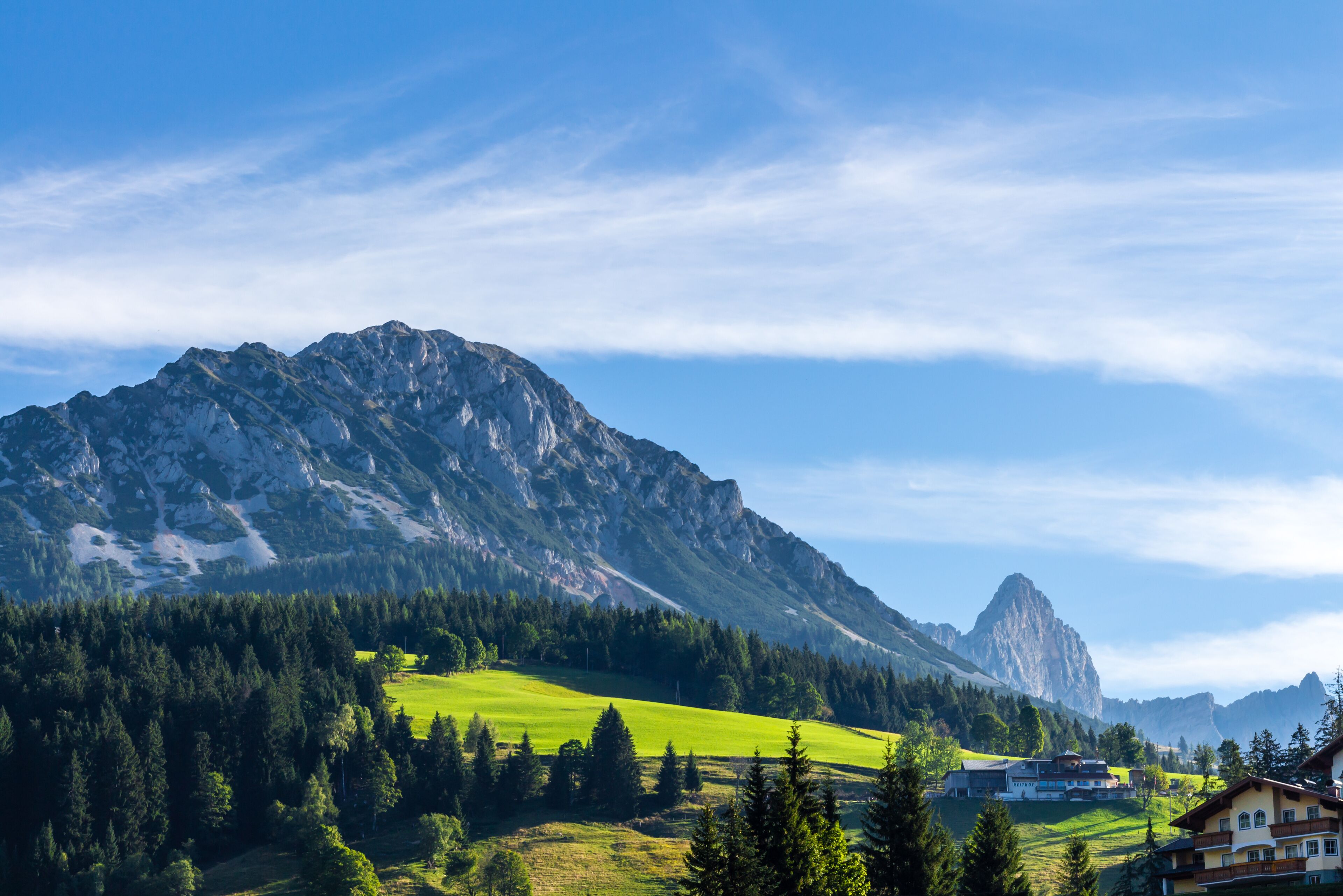 Landscape of mountains, green field, sky, forest in Filzmoos, Salzburg, Austria