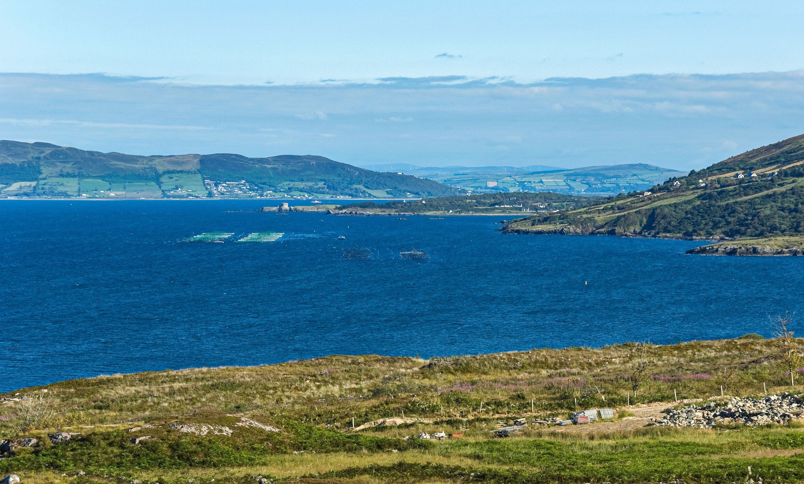 Salmon and oyster cages moored in a fish farm near Rathmullen, Lough Swilly, Donegal, Ireland, where intensive marine aquaculture is a controversial environmental issue.