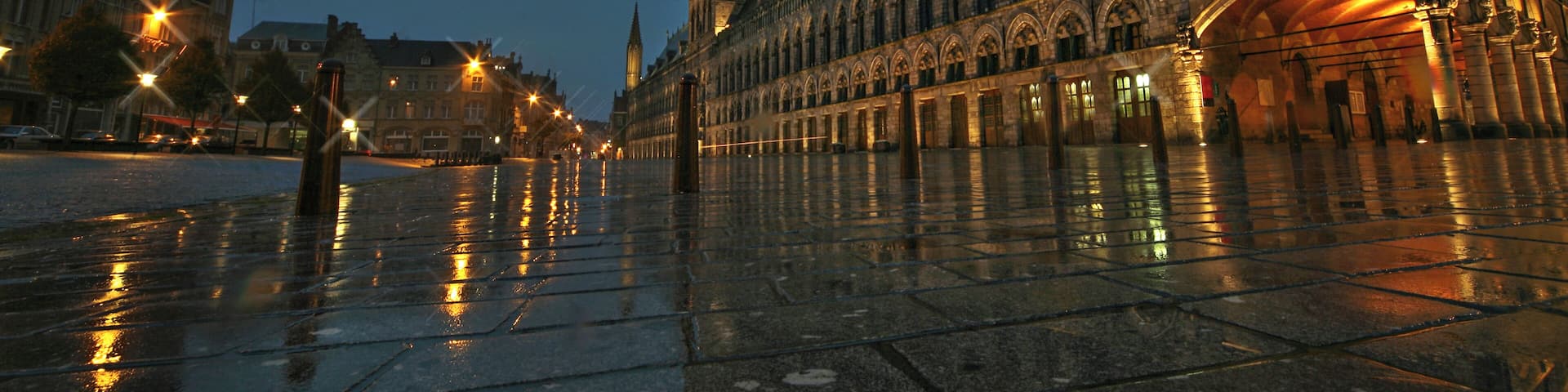 A historic building with intricate architecture and a large central tower.