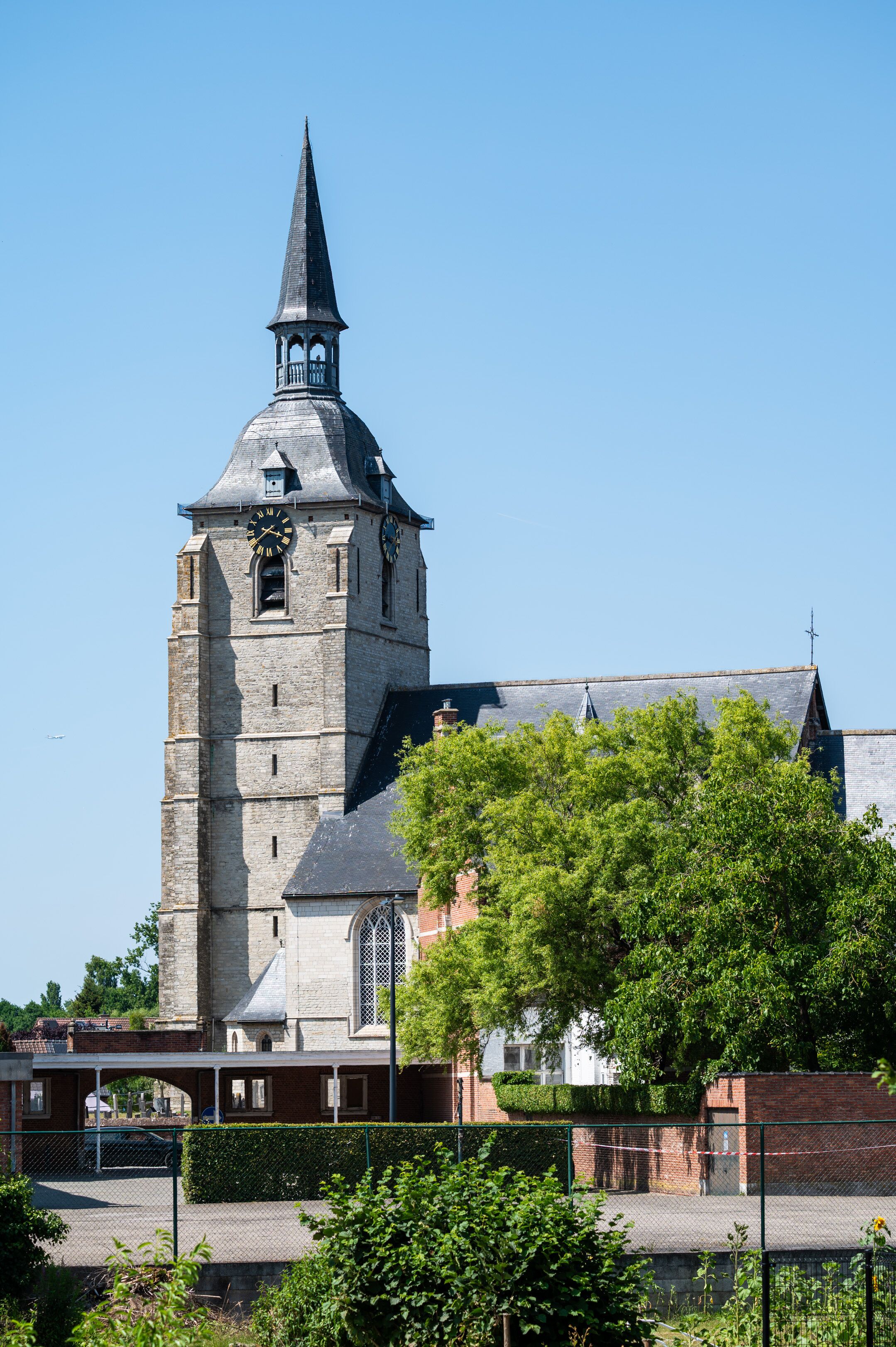 A historic church with a tall steeple and a clock tower.
