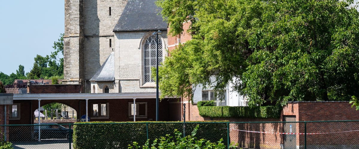 A historic church with a tall steeple and a clock tower.