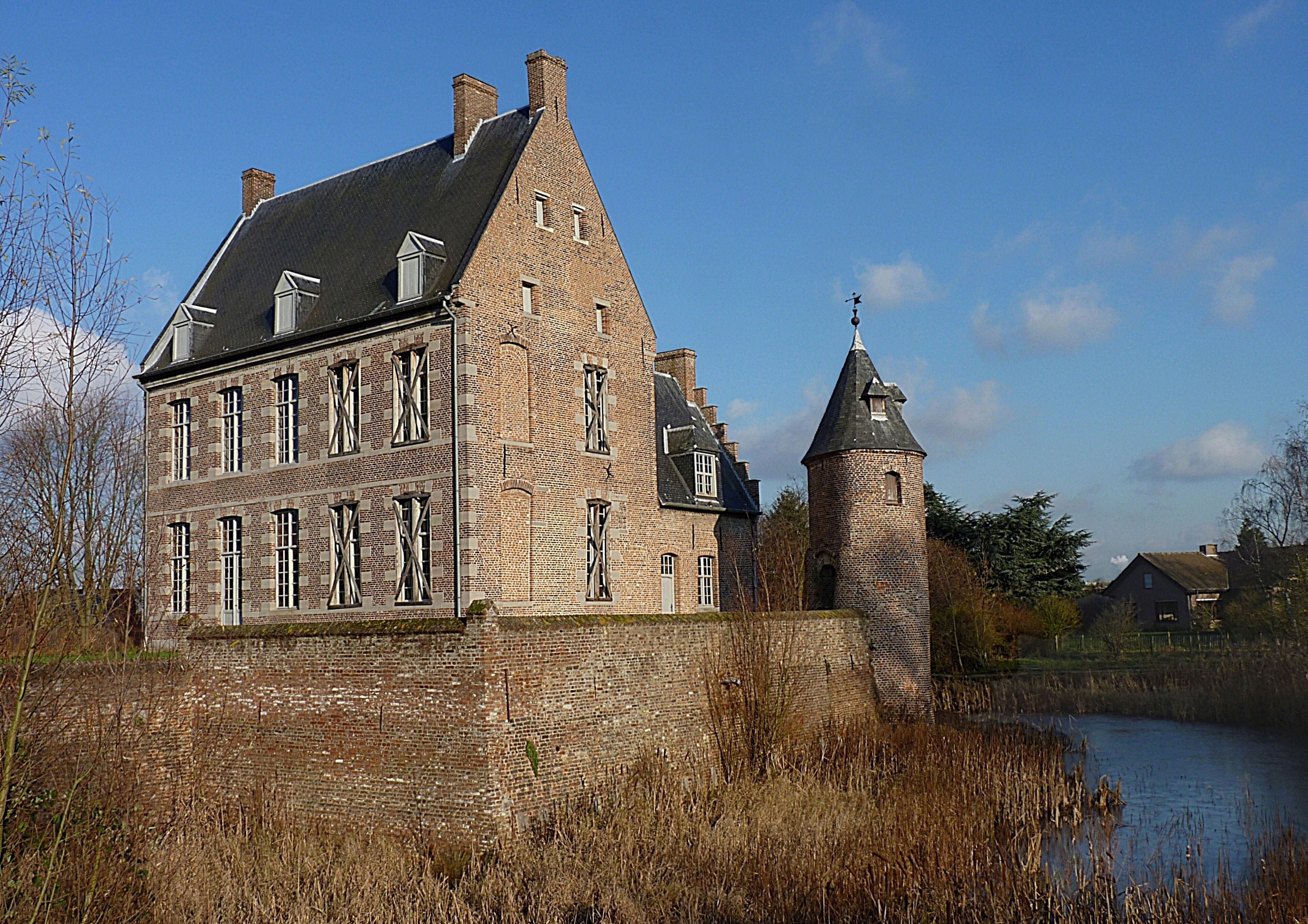 Castle of the Counts and moat in Mouscron, Belgium.