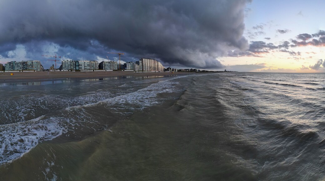Nieuwpoort, West-Vlaanderen, Belgium, September 13th, 2025, A stunning and beautiful seascape scene showcasing dramatic storm clouds above and serene waters reflecting the sunset