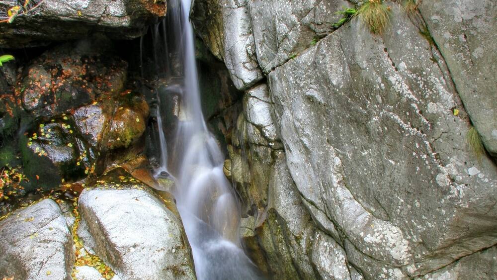 A waterfall by the way to Hubavetc hut.Golden autumn! Magic colors!