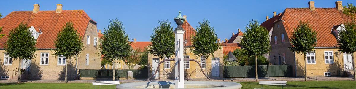 Panorama of the fountain and old houses in Christiansfeld, Denmark