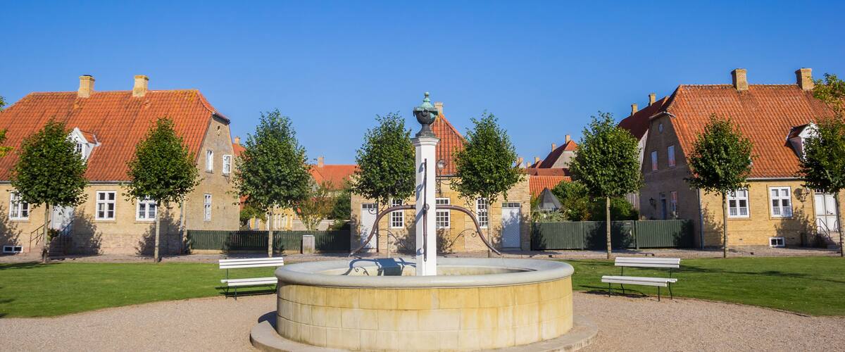 Panorama of the fountain and old houses in Christiansfeld, Denmark