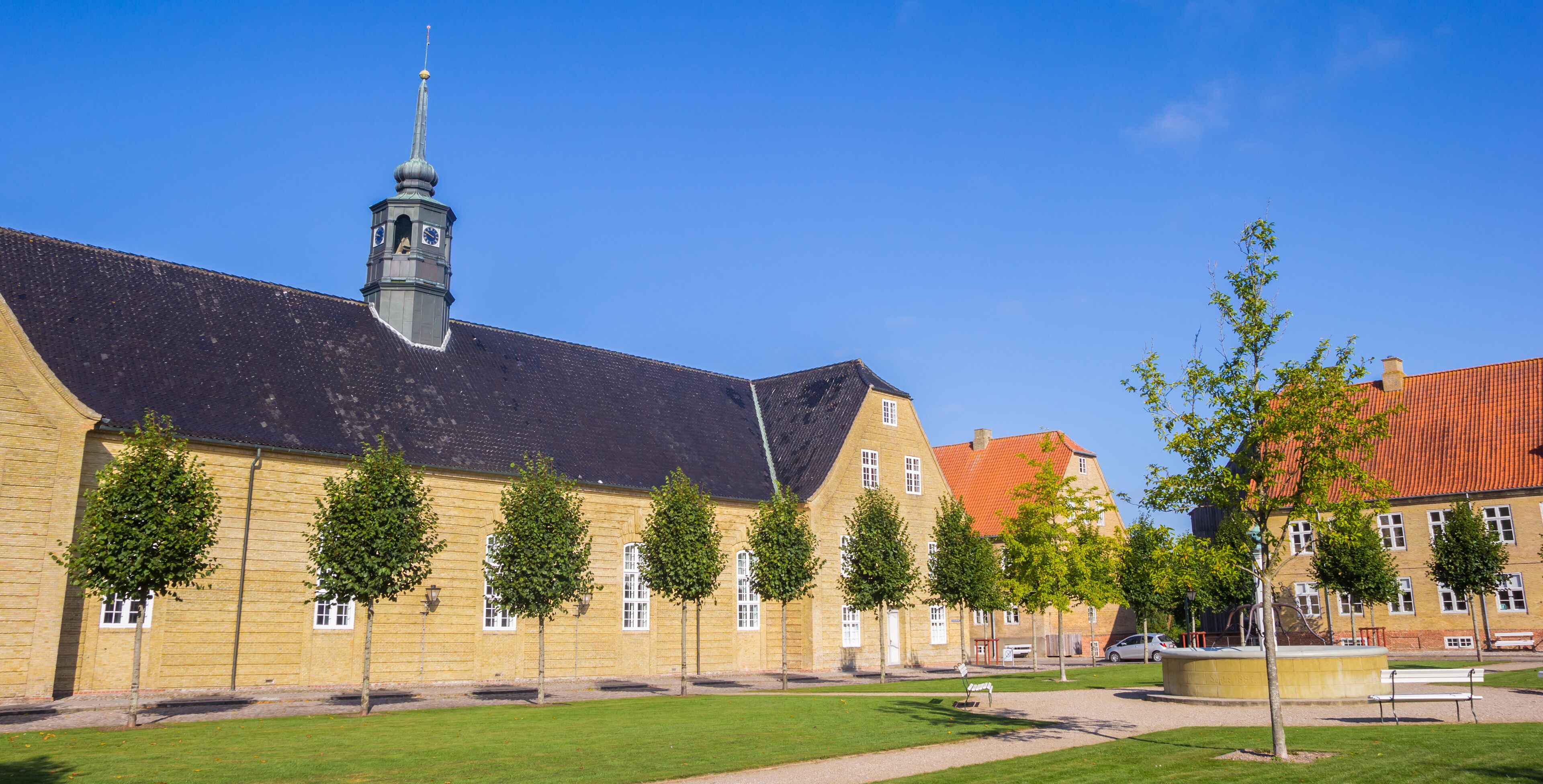 Panorama of the central square with historic church in Christiansfeld, Denmark