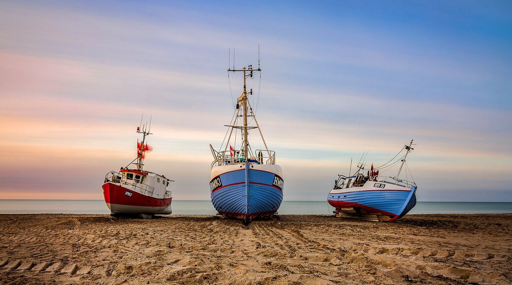 A beach where the lokal fishermen will drag their boats up on the beach each night unlike a normal harbor.