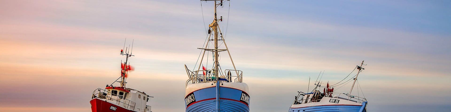 A beach where the lokal fishermen will drag their boats up on the beach each night unlike a normal harbor.