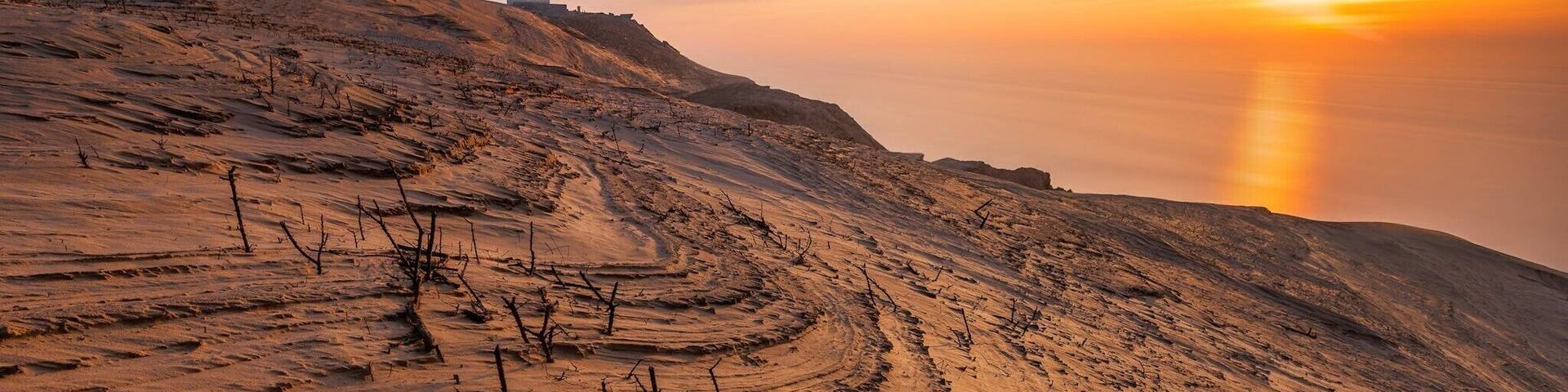 An old lighthouse build in 1900 and placed on a cliff 60m above sea level.
Over time, the lighthouse has been swallowed by the sand dunes, which make a a very unique place to visit. This is a must to visit if you're in Denmark/Jutland.
There is a parking lot 1 km- ish from the lighthouse and a great walk path right from the parking lot to the lighthouse.