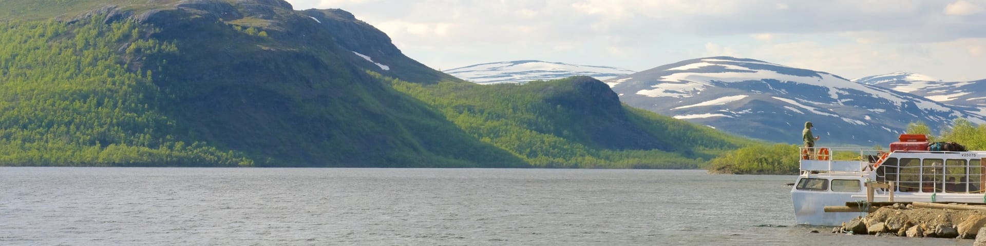 Kilpisjarvi featuring landscape views, mountains and a bay or harbor