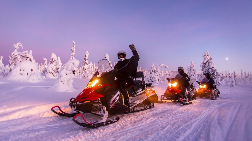 Salla which includes snow, a sunset and snowmobiling