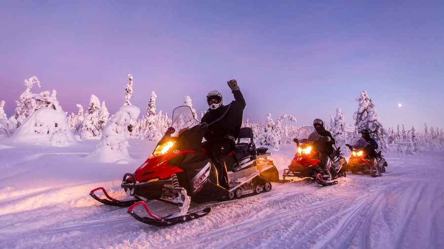 Salla which includes snowmobiling, a sunset and snow