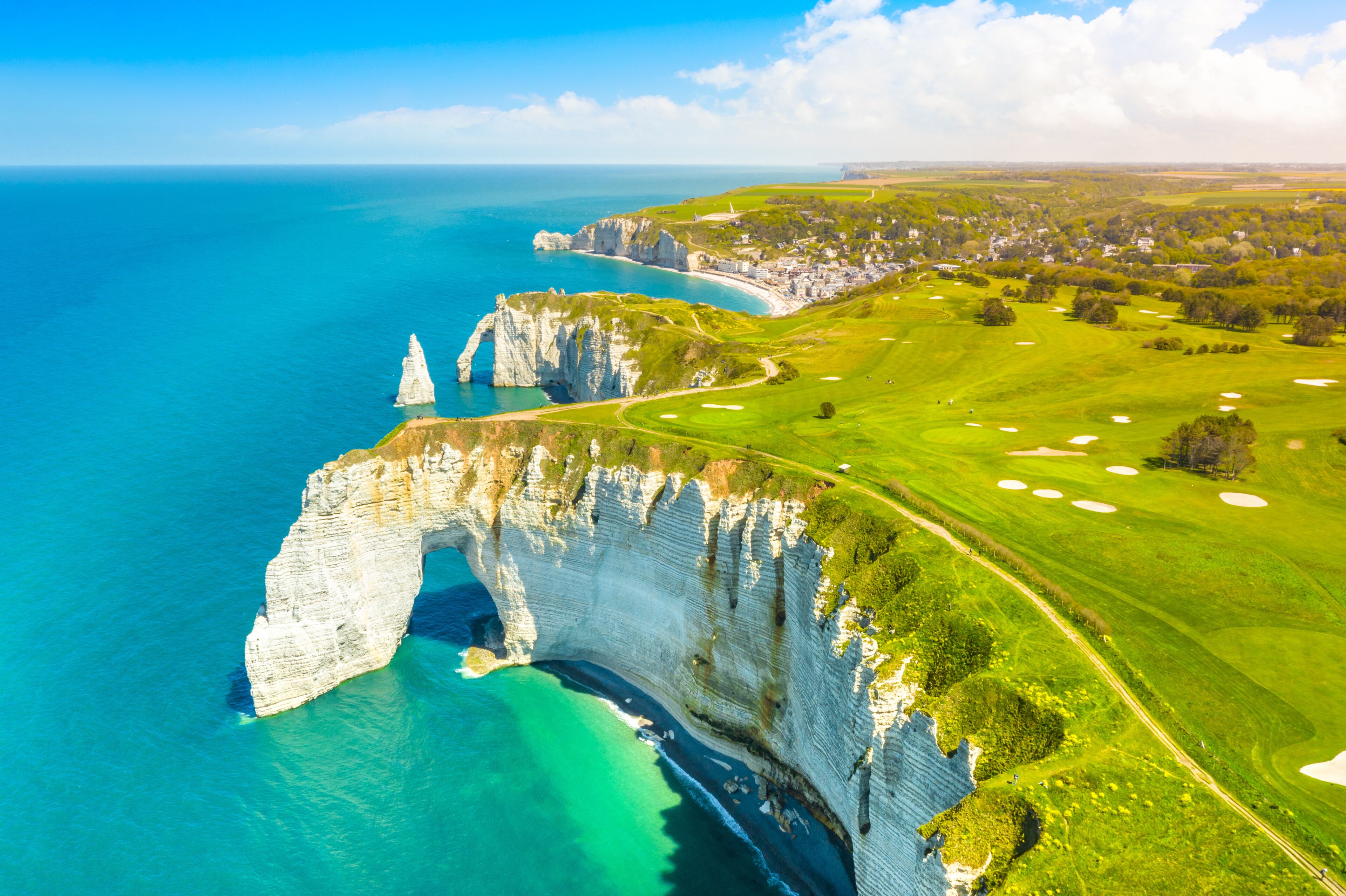 Picturesque panoramic landscape on the cliffs of Etretat. Natural amazing cliffs. Etretat, Normandy, France, La Manche or English Channel. Coast of the Pays de Caux area in sunny summer day. France