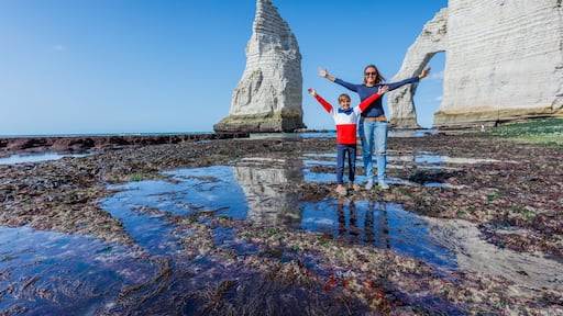Happy mother with her son having fun in the Etretat. France