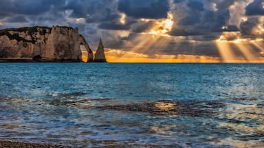 Colourful sunset at Etretat in the Upper Normandy in the North of France.The rocks formation is called L'Aiguille., Shutterstock ID 1115528630, Purchase Order: -