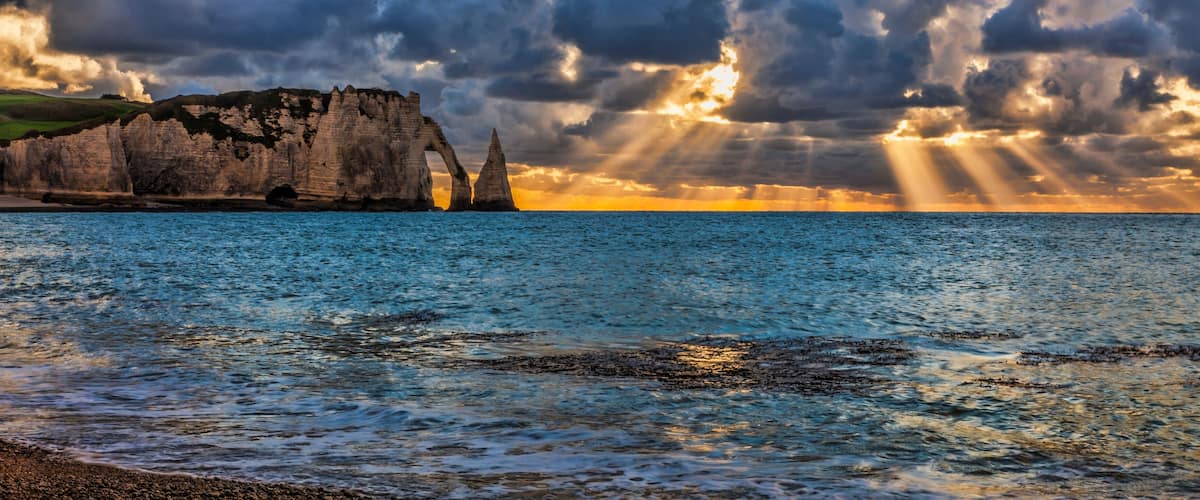 Colourful sunset at Etretat in the Upper Normandy in the North of France.The rocks formation is called L'Aiguille., Shutterstock ID 1115528630, Purchase Order: -