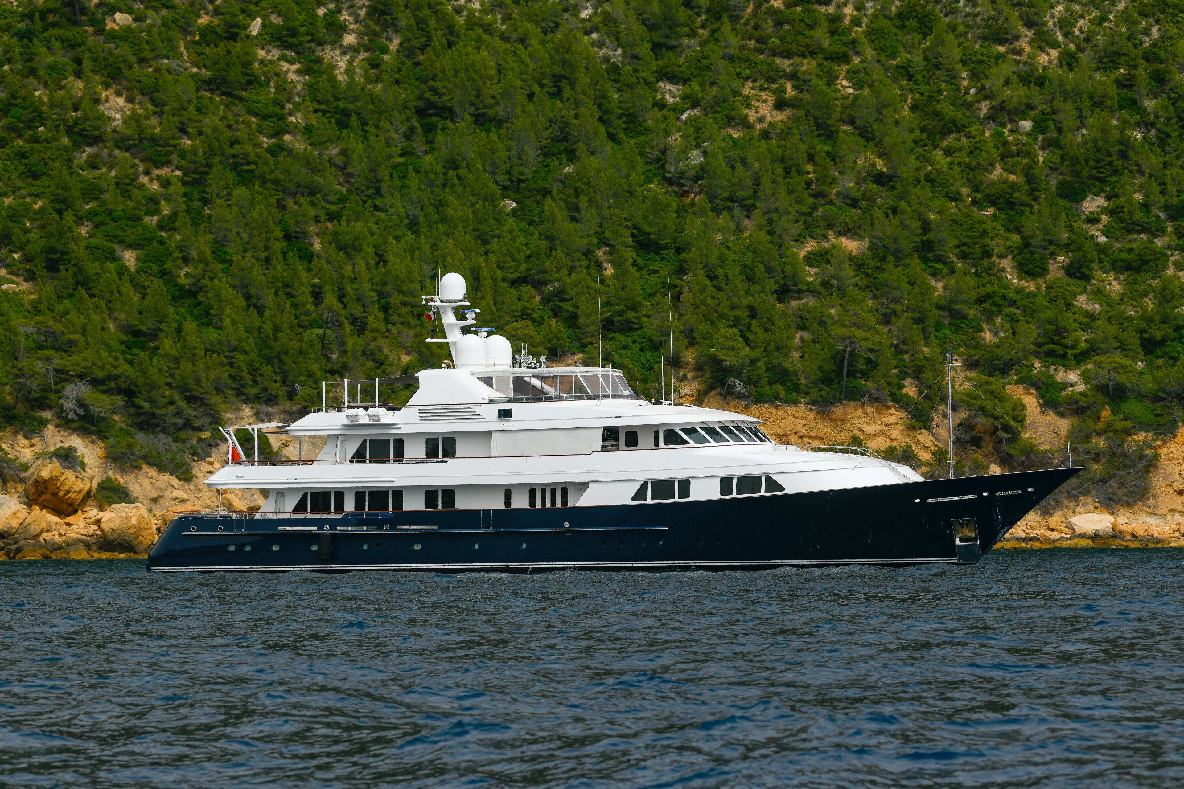 Scenic view of Magnificent luxury yacht and Cap Canaille headland and Cassis in south of France, High quality photo