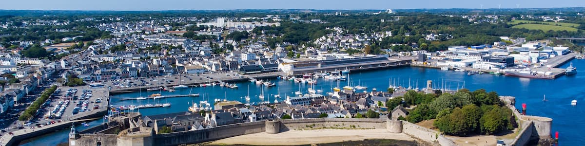 Aerial view of Concarneau, a medieval walled city in Brittany, France - Sandy beach under the fortifications of this island located in a bay along the coast of the Atlantic Ocean